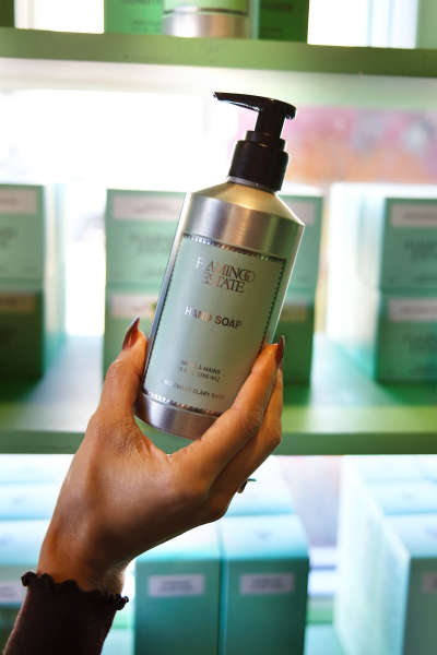 Shanna holding Flamingo Estate hand soap